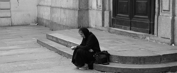 A black and white photograph of a seated woman